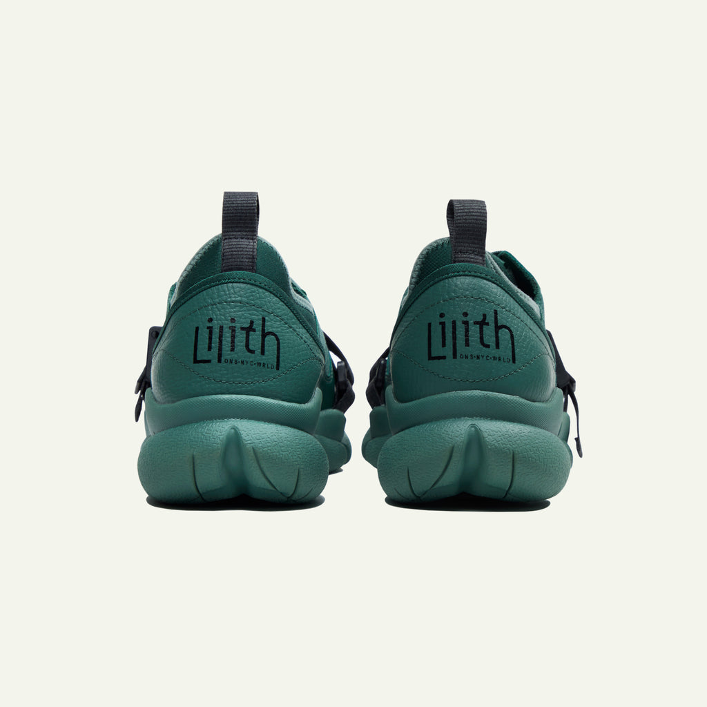 A back-view image of the Caudal Lure sneaker. The image is of Lilith NYC wordmark on the back heel of two sneakers.