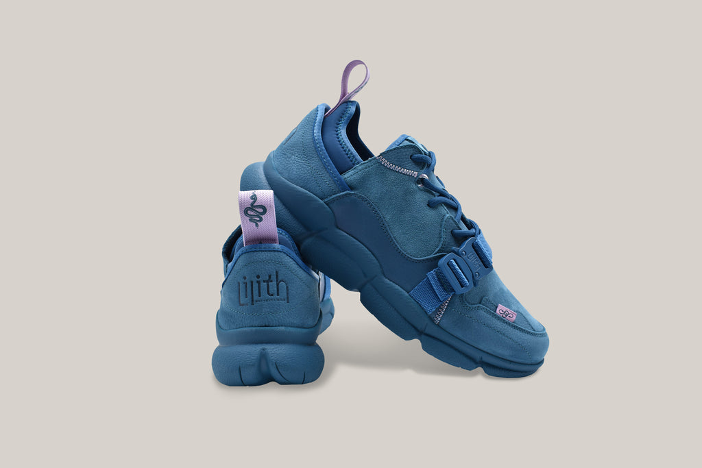 Kali Blue sneakers with the embossed Lilith NYC logo in view on the back heel of sneaker. 