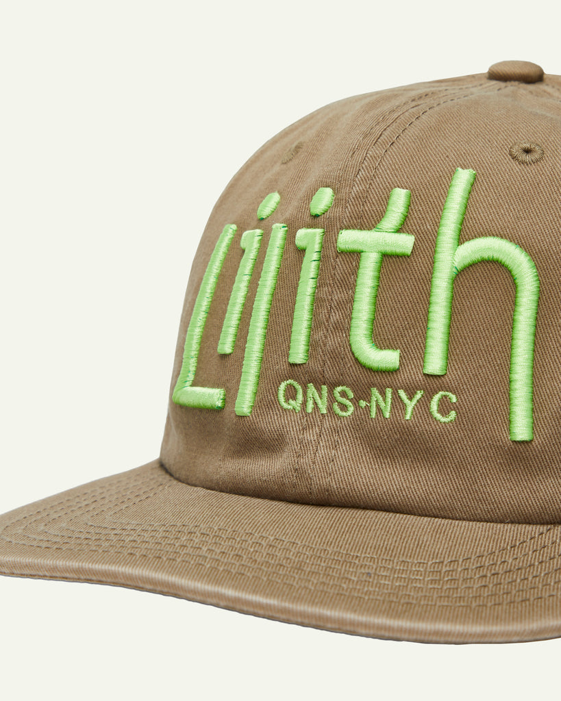 A light brown or coffee dad hat with a centered Lilith NYC wordmark in 3d puff embroidery. Embroidery is in a neon yellow colored thread. 