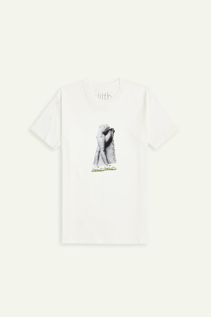 A cream or off-white colored crewneck t-shirt with the image of Shakti/Devi/Kali screen printed in the center. The figure is wearing a pair of white/beige/green sneakers that are in illustration form.