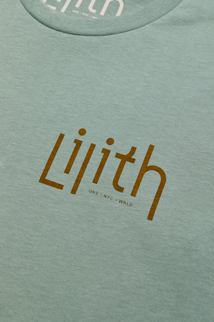 A light green or sage crewneck t-shirt with the Lilith NYC wordmark logo screen printed on the upper left chest area. The logo color is moss.
