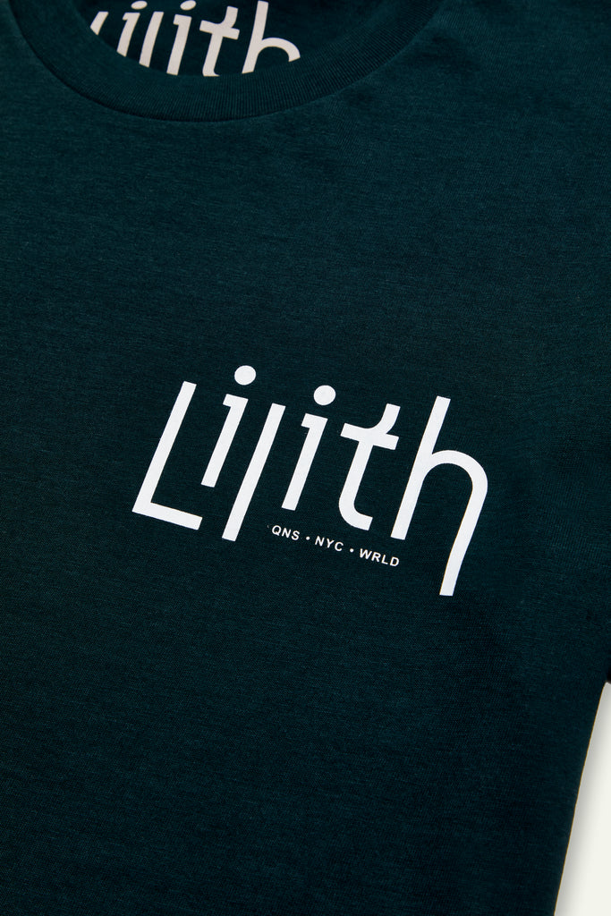 A dark green or forest green crewneck t-shirt with the Lilith NYC wordmark logo screen printed on the upper left chest area. The logo color is white.